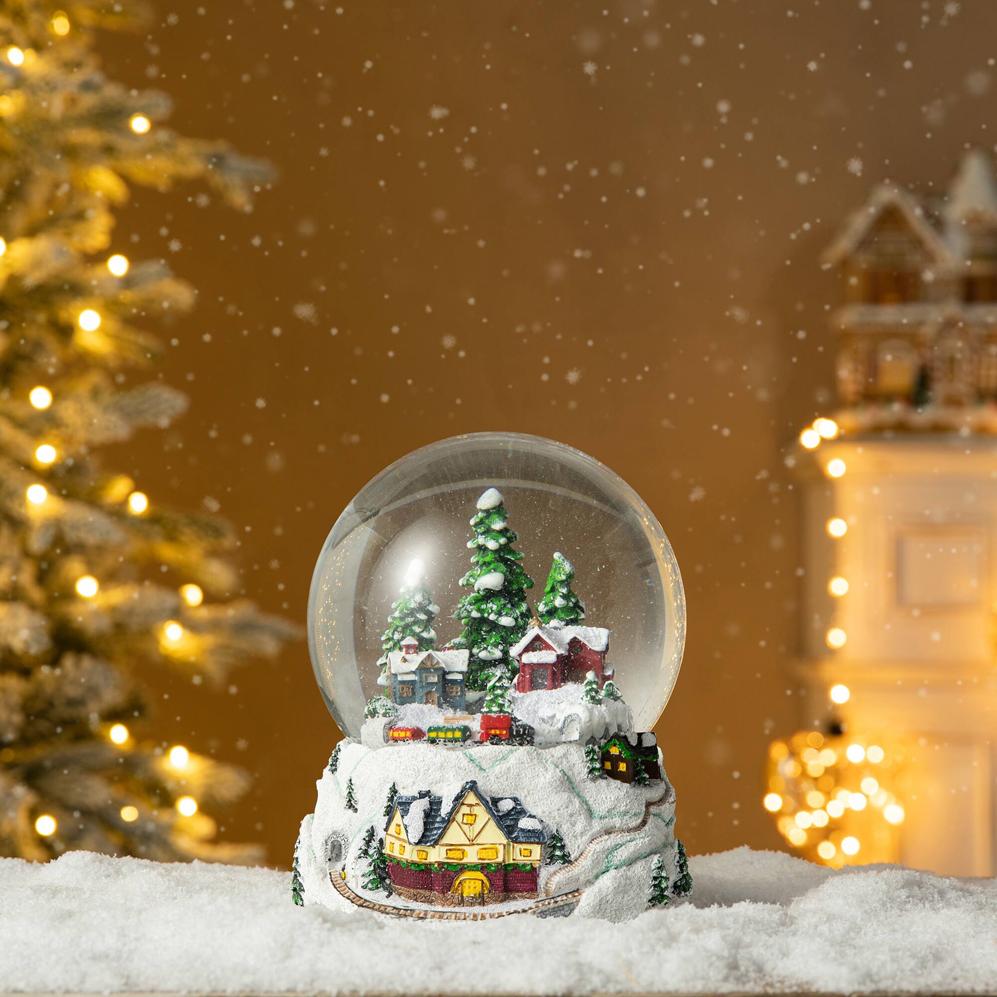 Glitzhome® 8" Lighted Musical Snowflakes Village Waterglobe